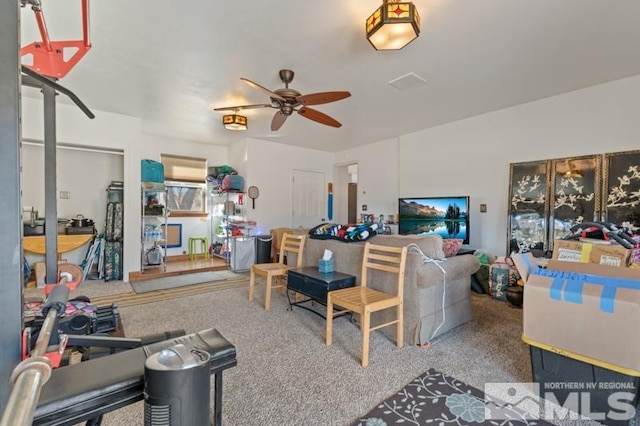 carpeted living room with ceiling fan