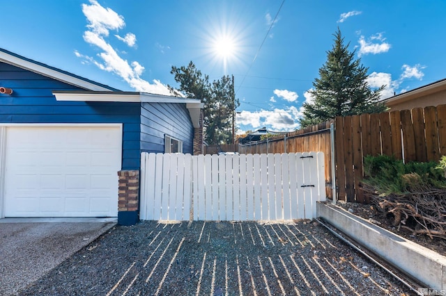 view of side of home with a garage