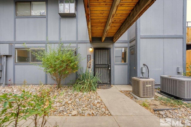 doorway to property featuring central AC