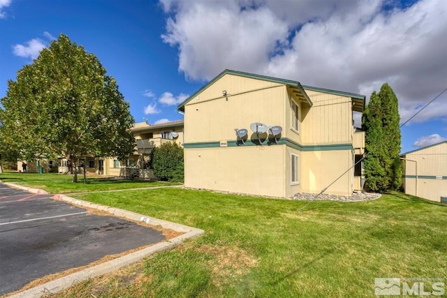 view of home's exterior featuring a lawn