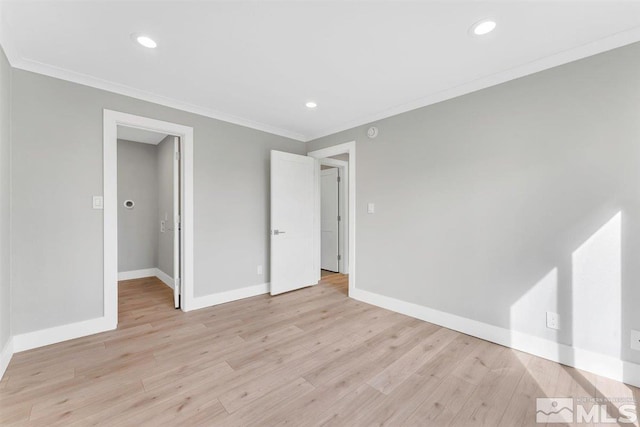 unfurnished bedroom with light hardwood / wood-style flooring and ornamental molding