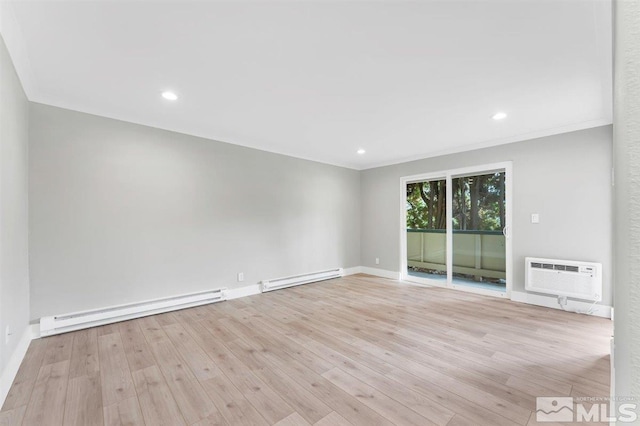 empty room with a baseboard radiator, a wall mounted AC, and light wood-type flooring