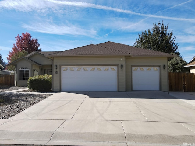 ranch-style home featuring a garage