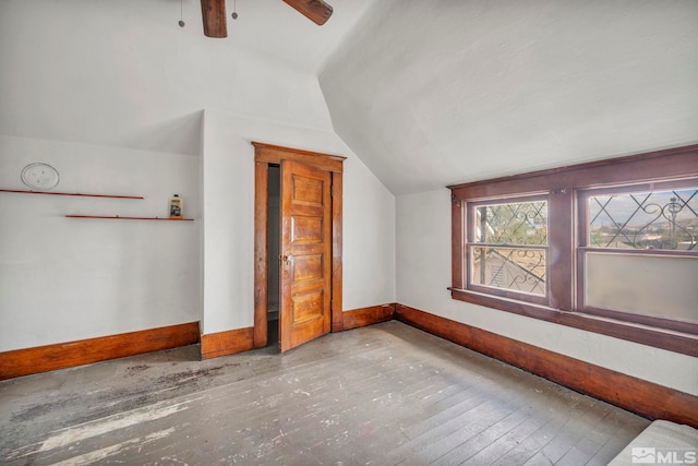 bonus room featuring hardwood / wood-style flooring, ceiling fan, and vaulted ceiling