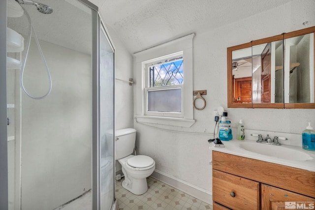 bathroom featuring a textured ceiling, toilet, ceiling fan, walk in shower, and vanity