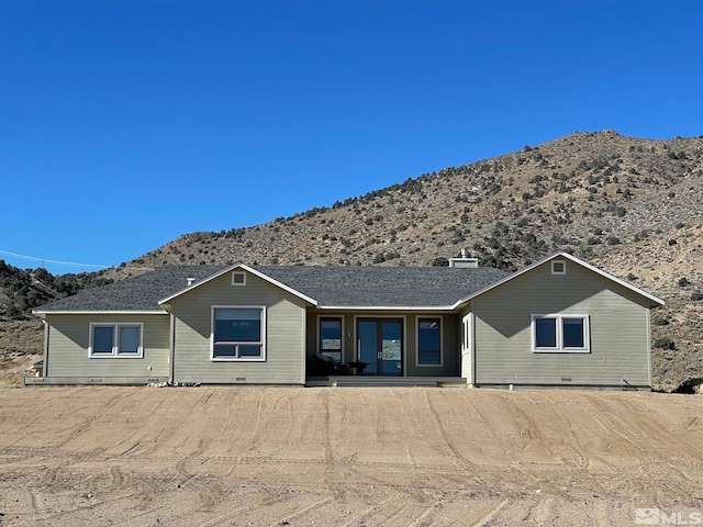 rear view of house with a mountain view