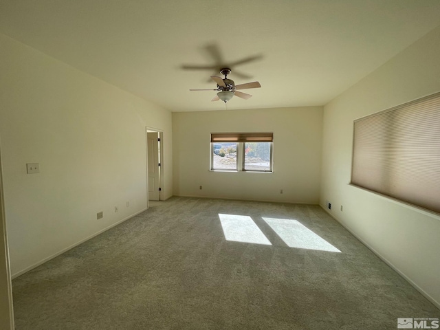 carpeted empty room with ceiling fan