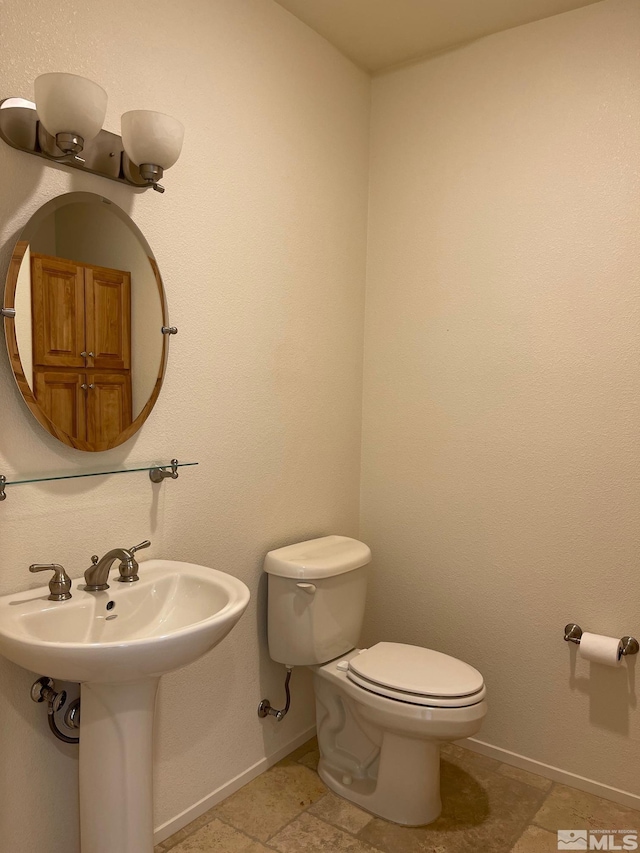 bathroom with toilet and sink