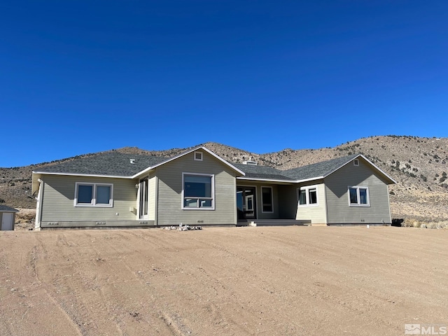 view of front of home with a mountain view