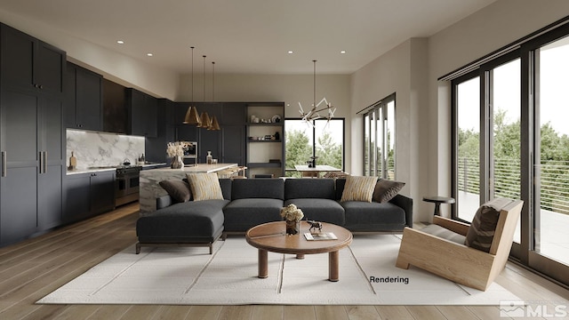 living room with a chandelier and light wood-type flooring