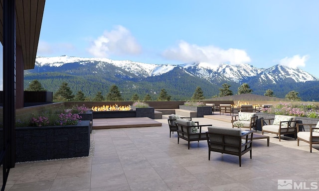 view of patio with a mountain view and outdoor lounge area