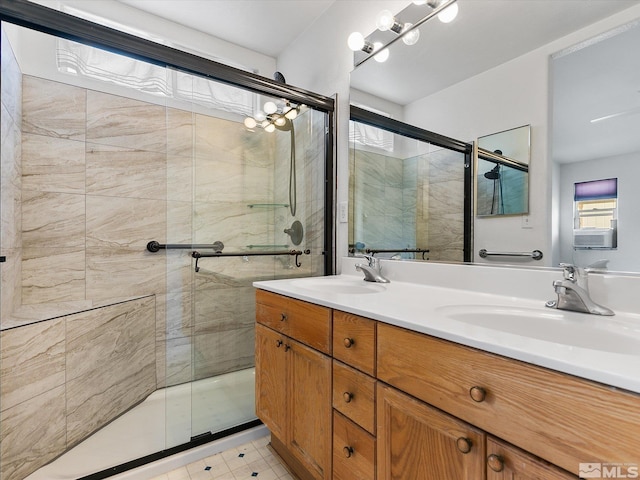 bathroom featuring vanity, tile patterned flooring, and walk in shower