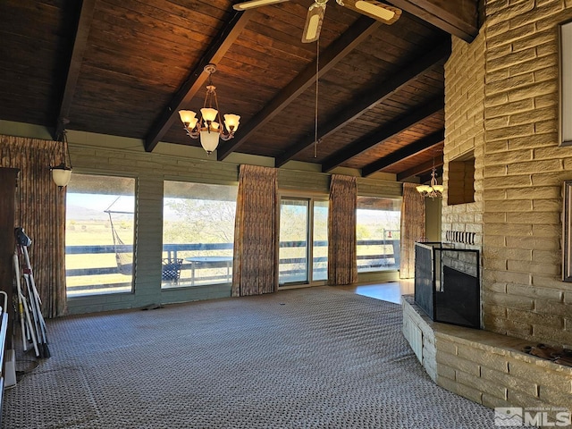 unfurnished living room featuring an outdoor brick fireplace, lofted ceiling with beams, a chandelier, and wooden ceiling