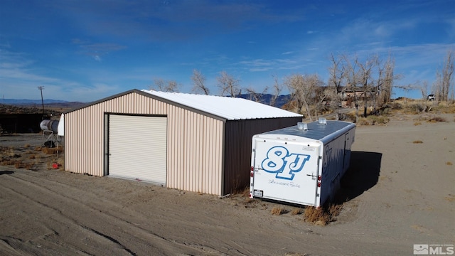 view of outdoor structure with a garage