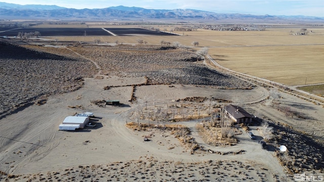 bird's eye view with a mountain view and a rural view