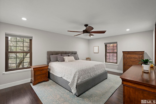 bedroom featuring ceiling fan and dark hardwood / wood-style floors