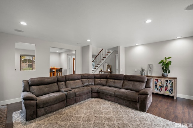 living room with dark hardwood / wood-style floors