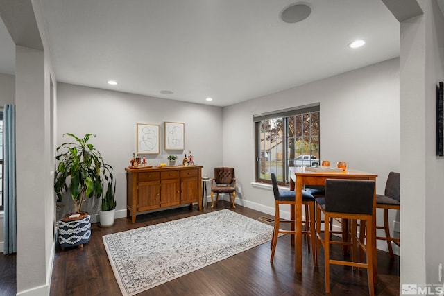 dining area with dark wood-type flooring