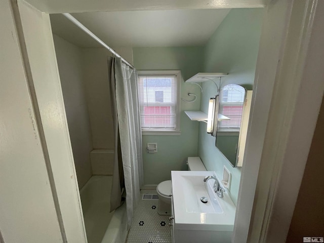 full bathroom with toilet, vanity, tile patterned flooring, and shower / bath combo with shower curtain