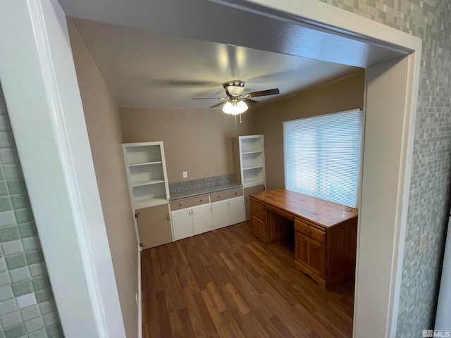 kitchen featuring hardwood / wood-style flooring, ceiling fan, and built in desk