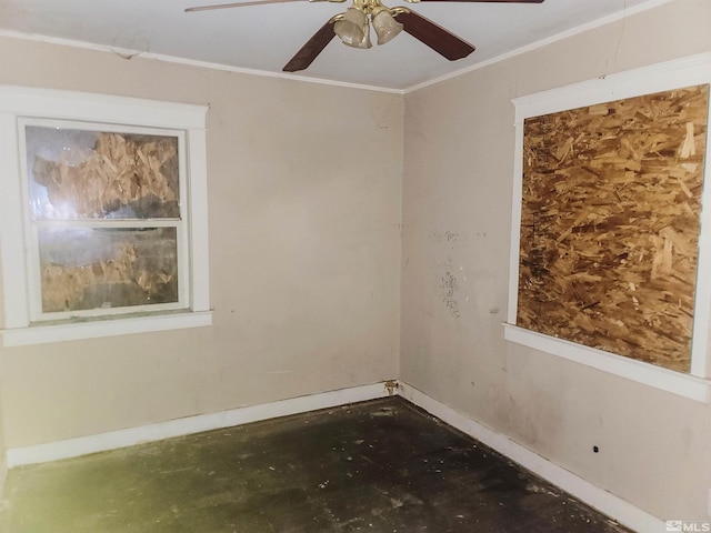 spare room with ceiling fan and crown molding