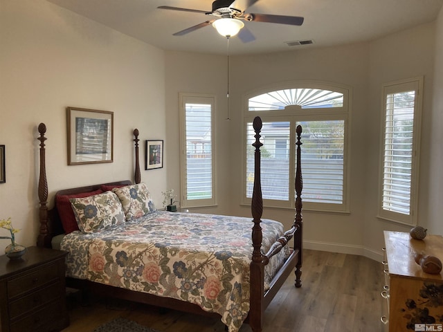 bedroom with hardwood / wood-style flooring and ceiling fan