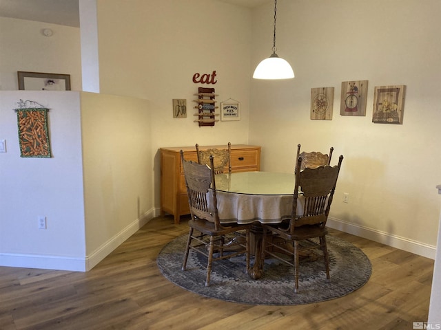 dining area with dark hardwood / wood-style floors