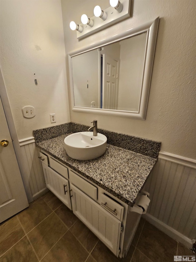 bathroom with tile patterned flooring and vanity