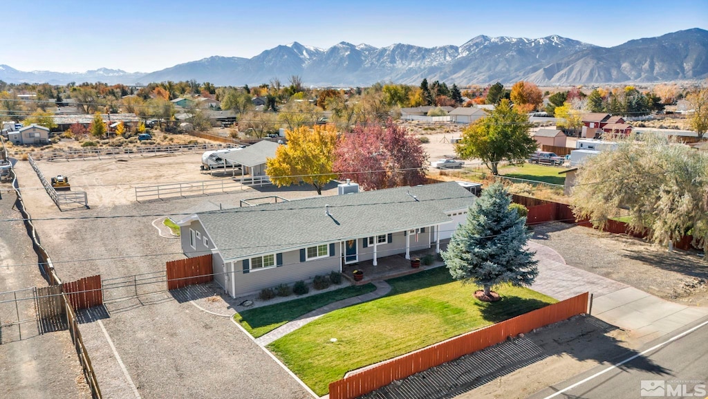 birds eye view of property with a mountain view