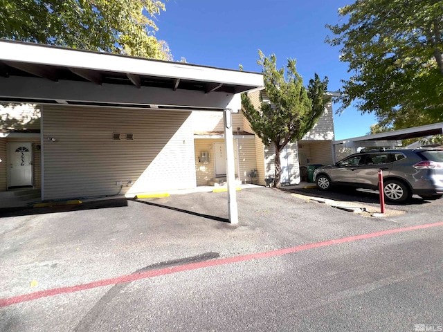 view of vehicle parking with a carport