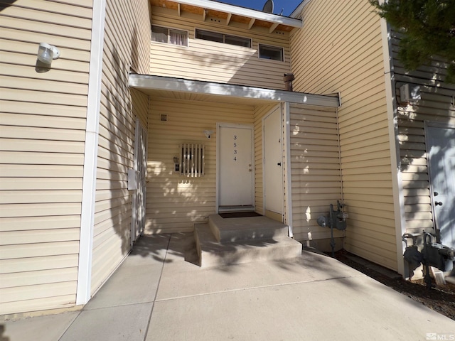 doorway to property with a patio