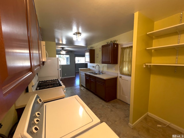 kitchen featuring sink, white appliances, and ceiling fan