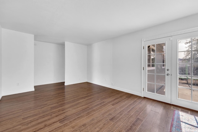 unfurnished room featuring french doors and dark hardwood / wood-style floors