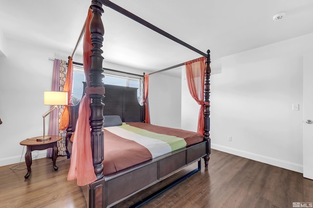 bedroom featuring wood-type flooring