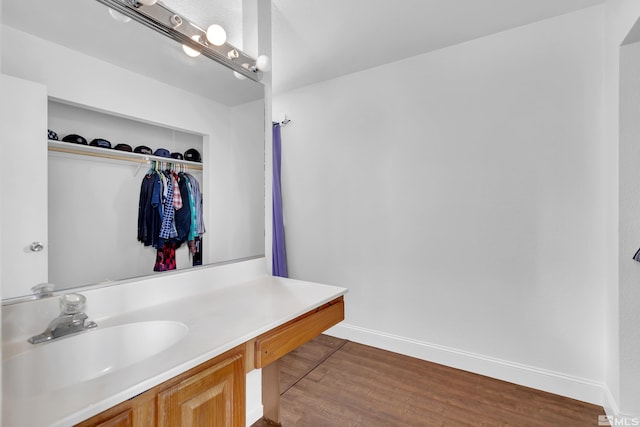 bathroom featuring vanity and hardwood / wood-style flooring