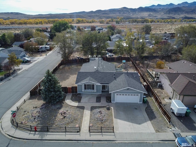 birds eye view of property featuring a mountain view