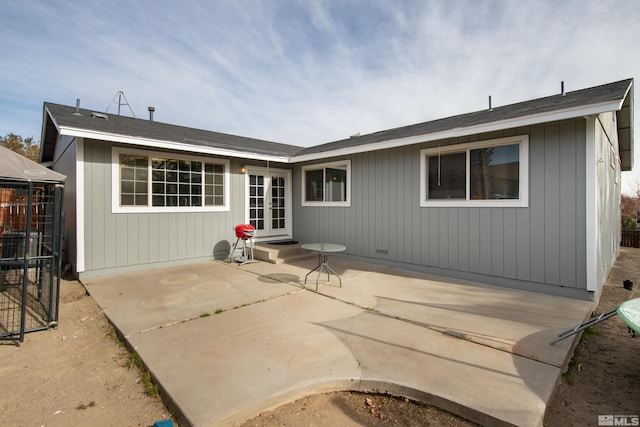 back of property featuring a patio area and french doors