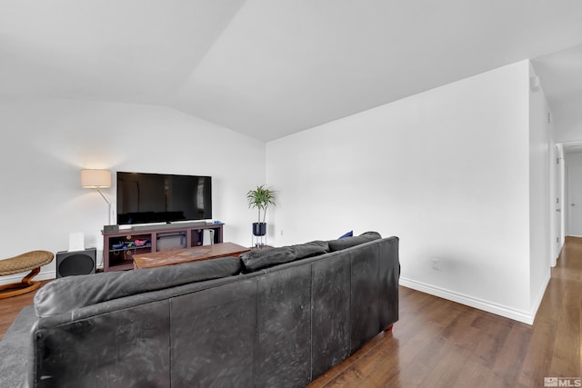 living room with hardwood / wood-style flooring and vaulted ceiling