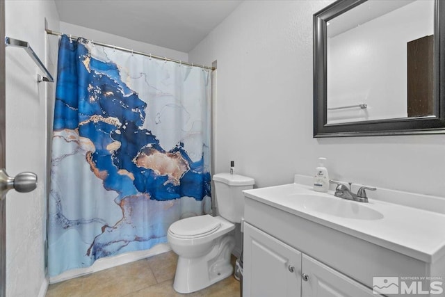 bathroom featuring tile patterned floors, vanity, toilet, and a shower with curtain