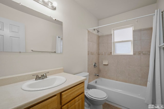 full bathroom with toilet, shower / bath combo, and vanity