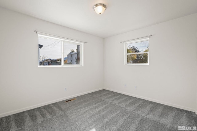 empty room featuring carpet flooring