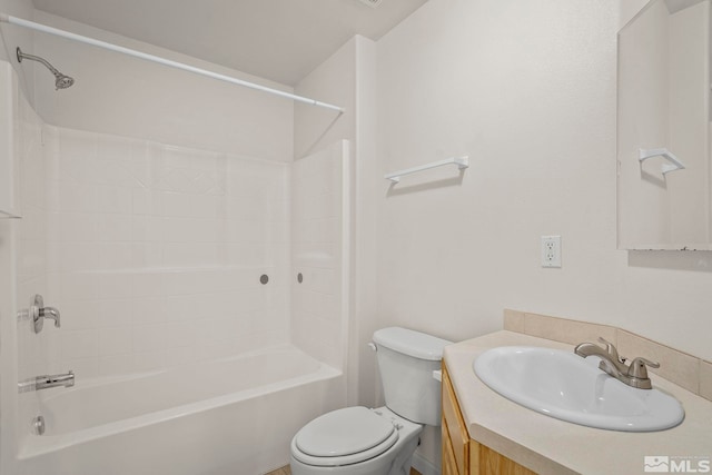 full bathroom featuring washtub / shower combination, vanity, and toilet