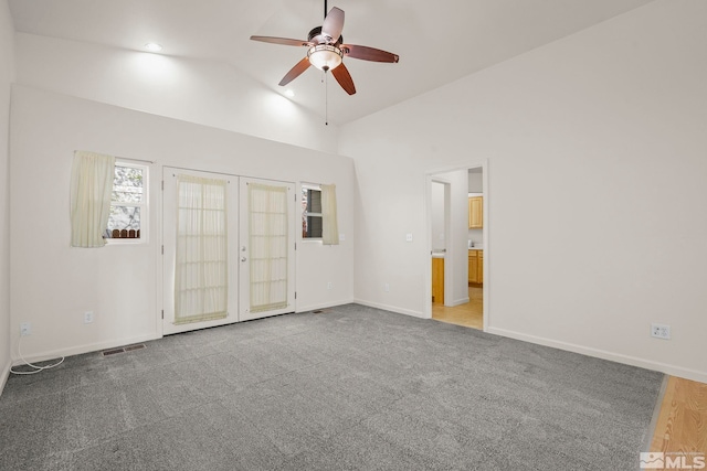 interior space featuring ceiling fan, french doors, and lofted ceiling