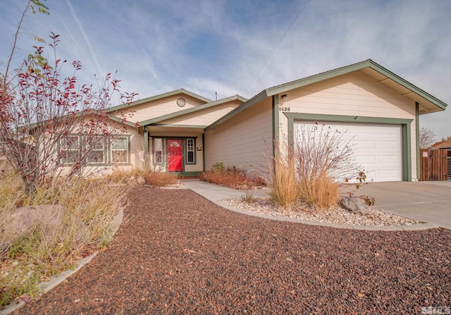 ranch-style house featuring a garage