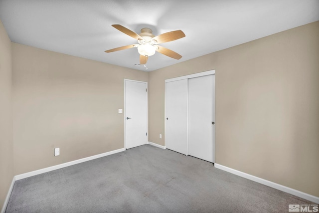 unfurnished bedroom with light colored carpet, ceiling fan, and a closet