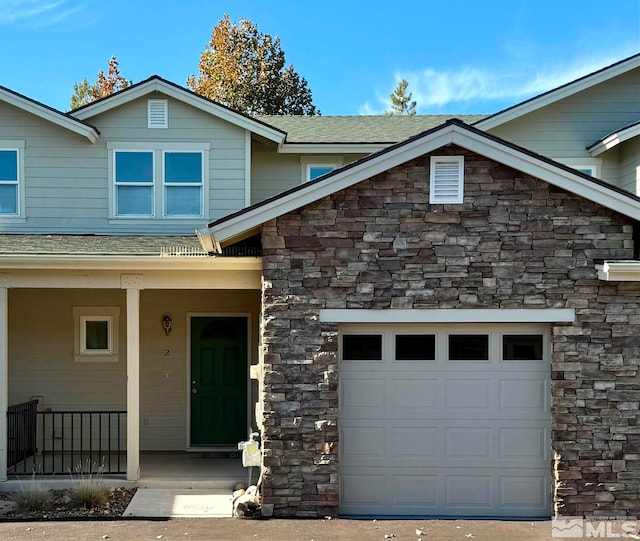 view of front of house with a garage and covered porch