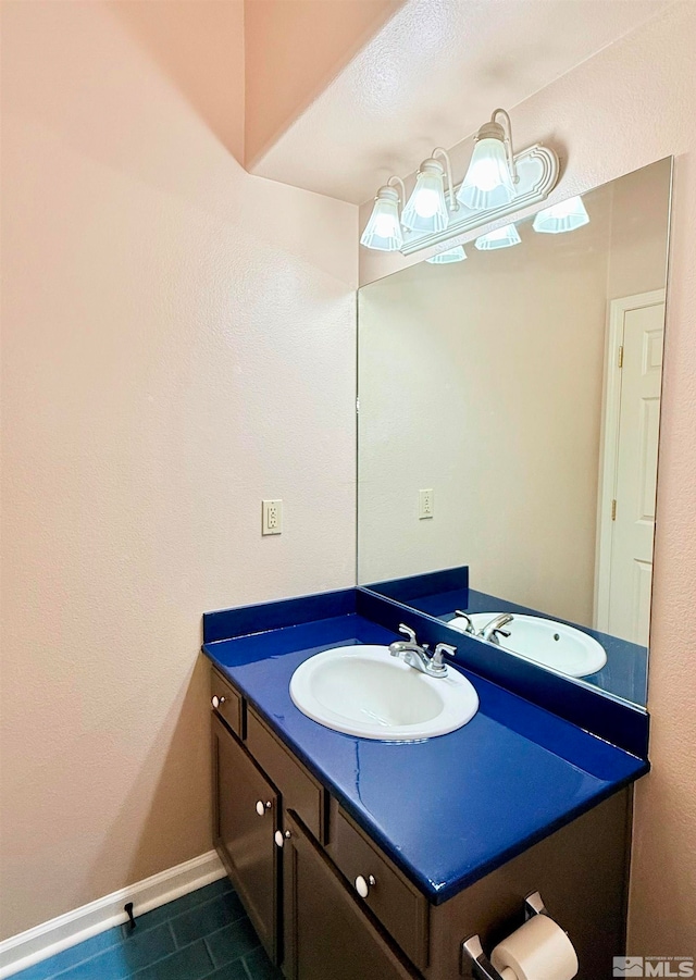 bathroom with vanity and tile patterned floors