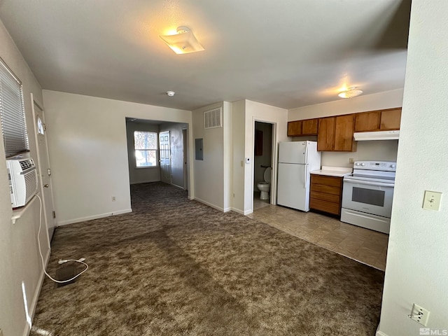 kitchen featuring electric panel, white appliances, and light carpet