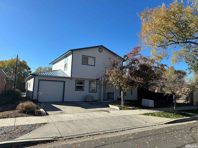 view of front of property featuring a garage