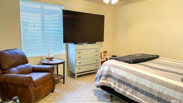 bedroom featuring light colored carpet